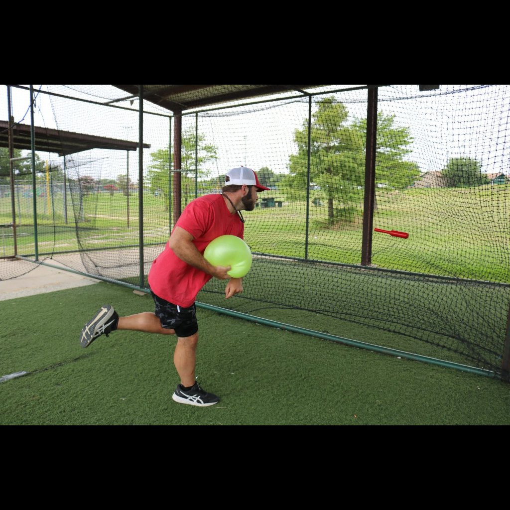 Connector Throwing Club is thrown and released. The club is hitting a net straight out in front of the athlete.