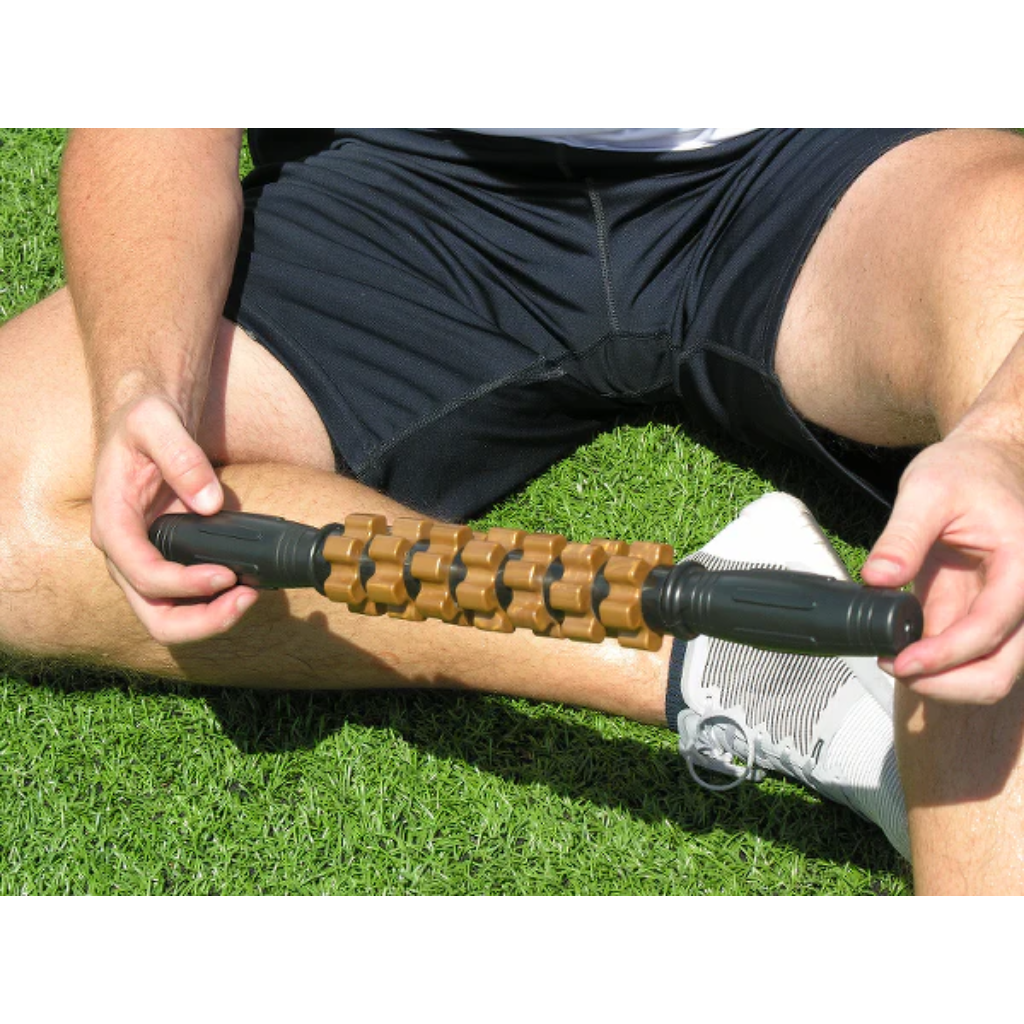 An athlete holding up a relief stick to display its size.