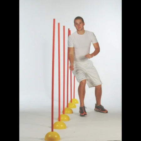 Indoor Agility Set with an athlete weaving in and out of the poles to discover new speed and agility.