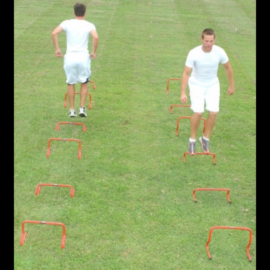 TAP Mini-Hurdles used in plyometric drill by two athletes.