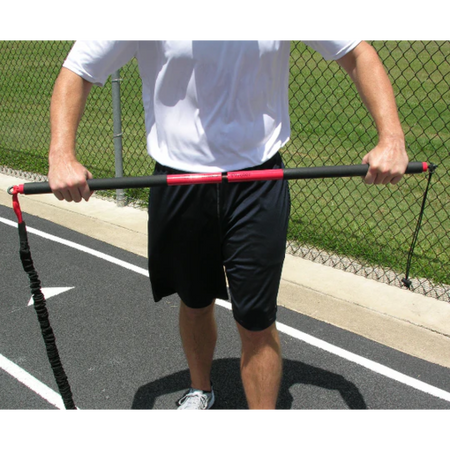 Athlete using a threaded stud to assemble the KHAOS® Pivoter Bar, preparing for a strength and stability workout with dynamic resistance training.