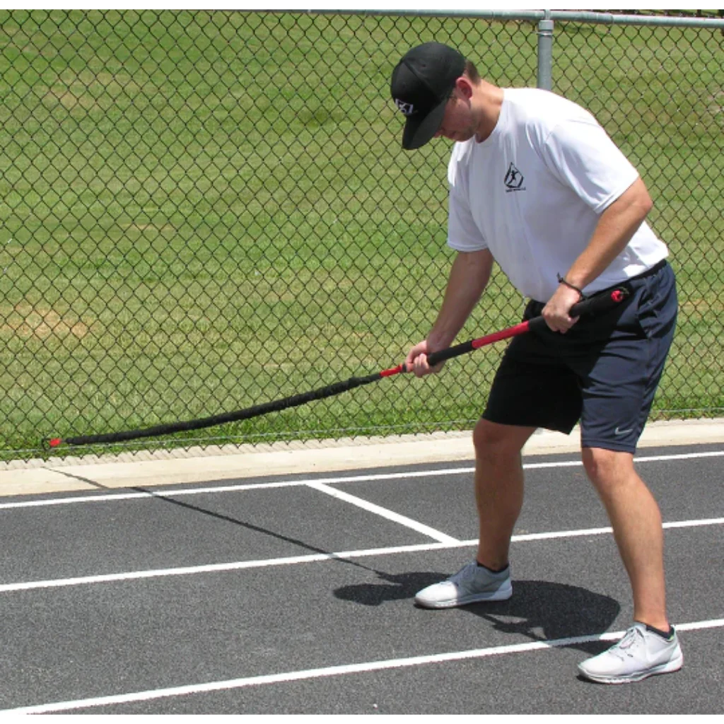 Athlete performing resisted trunk twists with the KHAOS® Pivoter Bar, engaging core stability, rotational strength, and controlled movement during dynamic resistance training.