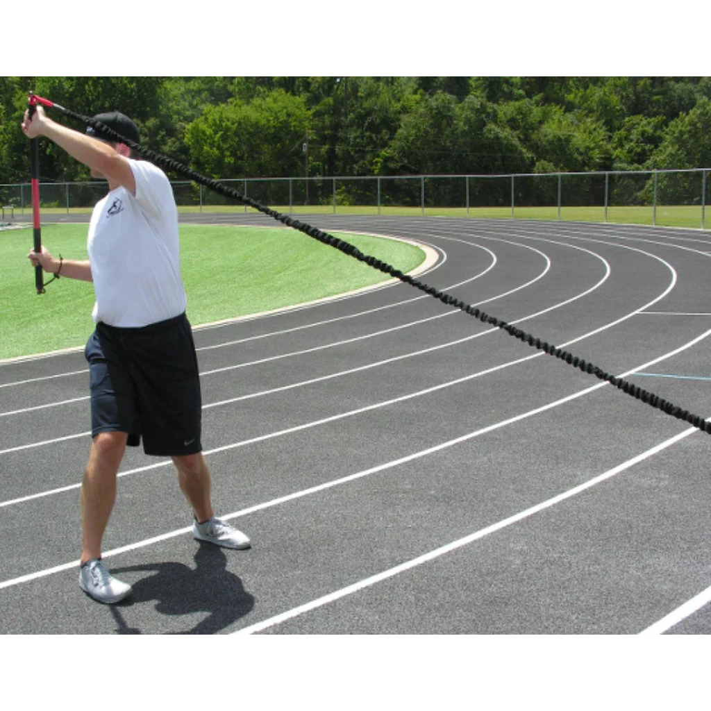 Athlete executing an upward crossbody rotation, engaging core muscles to enhance strength, stability, and controlled movement during functional training.