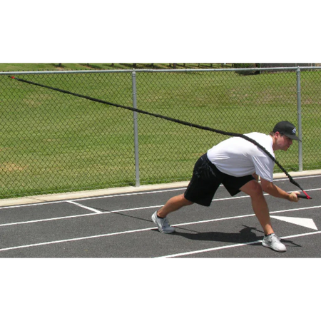 Athlete executing a resisted full-body chop with the KHAOS® Pivoter bar, engaging core rotation, stability, and power during dynamic strength training.