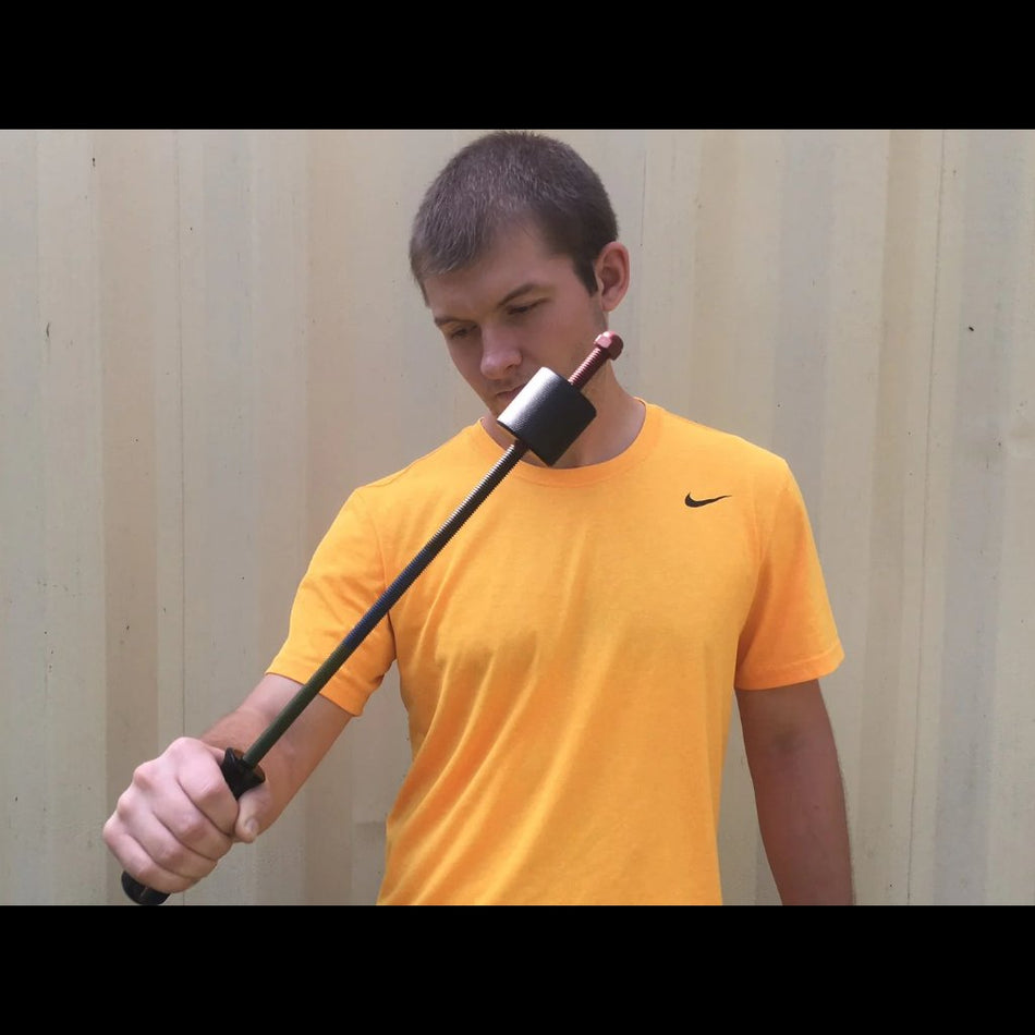 An athlete performs a wrist-strengthening exercise using the Supi Pro device, executing a slow and controlled pronation movement to target forearm and wrist muscles.