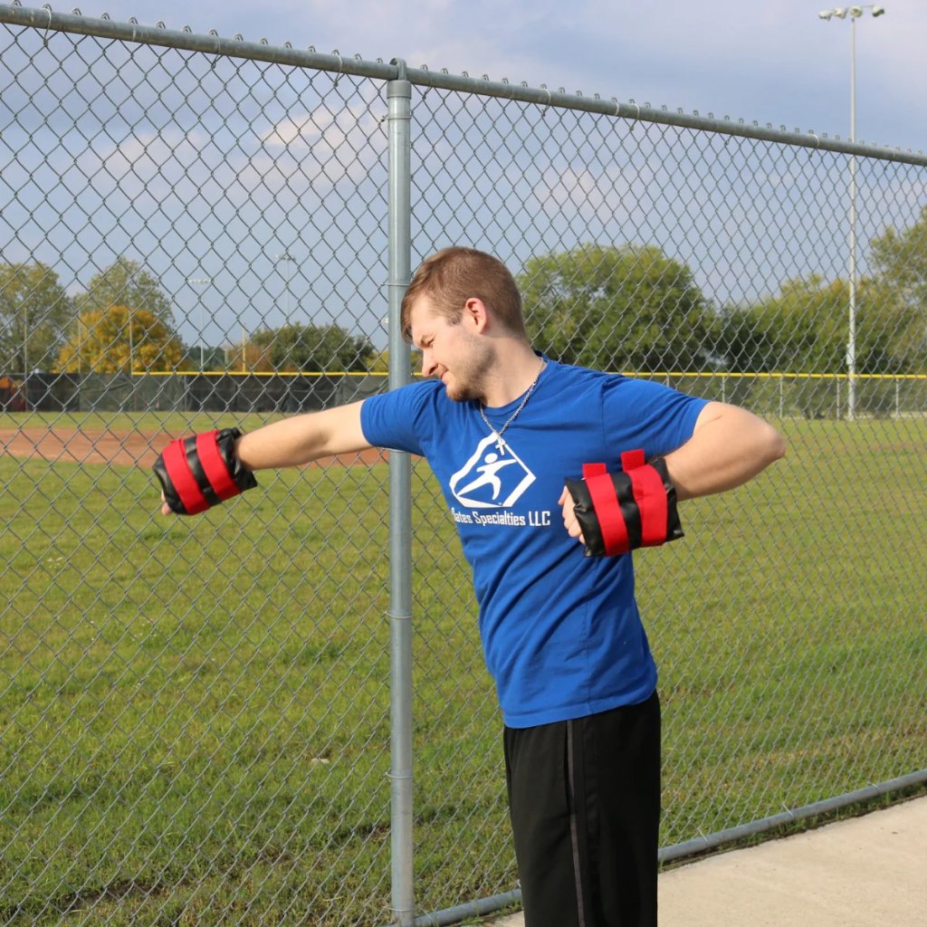 An athlete performing swimming exercise with the Synthetic Leather Weighted Cuffs to strengthen his shoulders and upper body