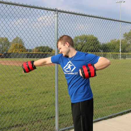 An athlete performing swimming exercise with the Synthetic Leather Weighted Cuffs to strengthen his shoulders and upper body