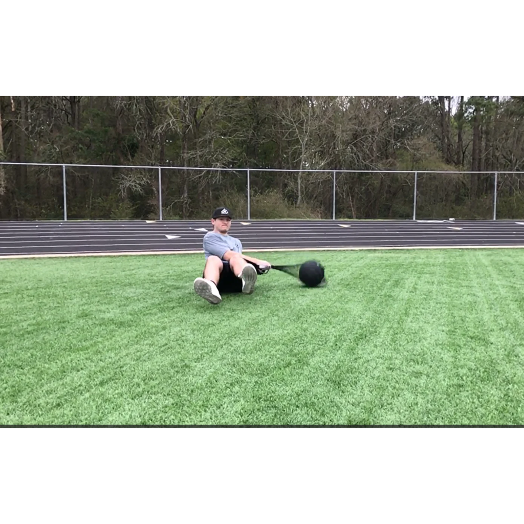 Man performing speed drill exercises with Hammer Net and Speedball on artificial turf.