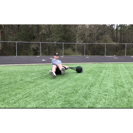 Man performing speed drill exercises with Hammer Net and Speedball on artificial turf.