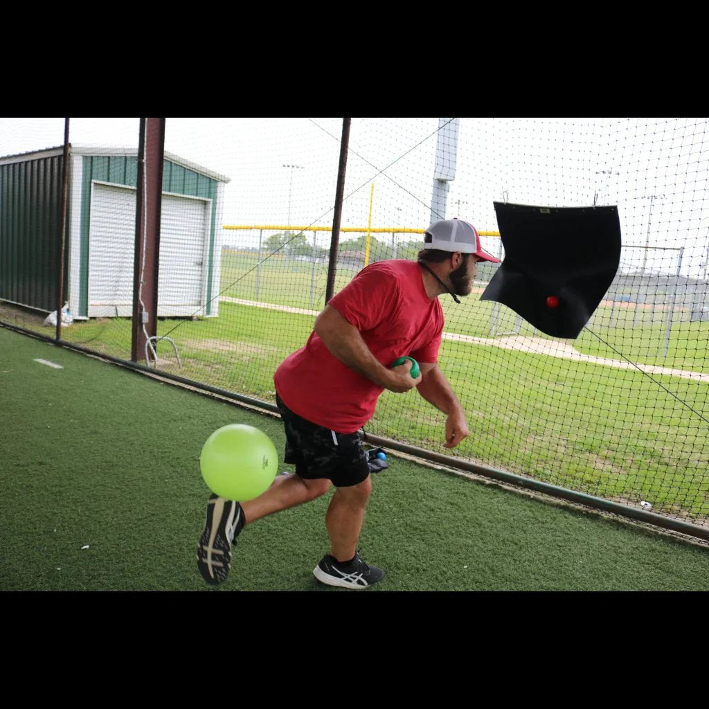 The TAP Connection Ball is released and dropped straight down providing immediate feedback that the athlete did not independently raise his elbow above his shoulder during his throw