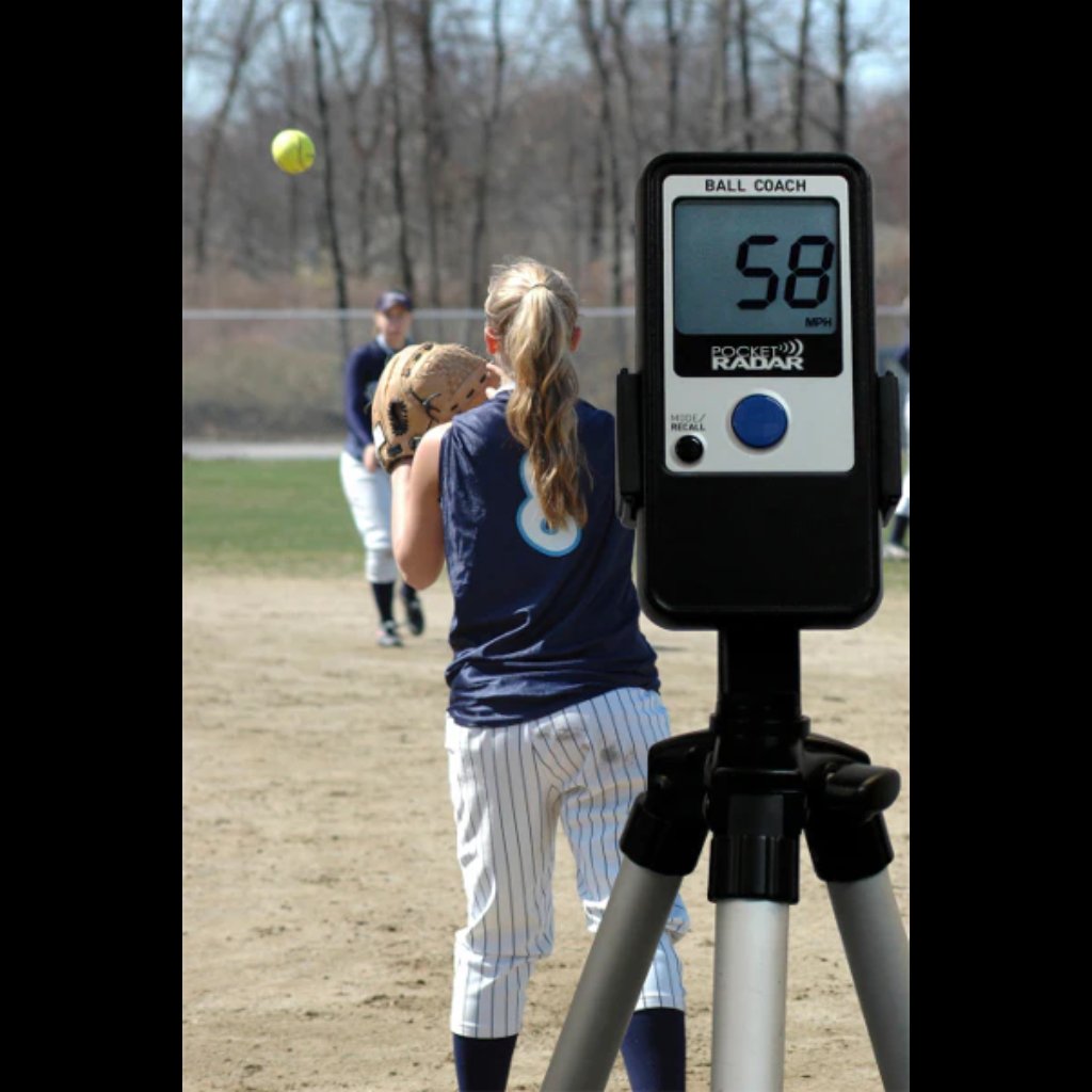 Ball Coach™ radar gun capturing throwing velocity during a softball drill—perfect for tracking arm strength and progress over time.
