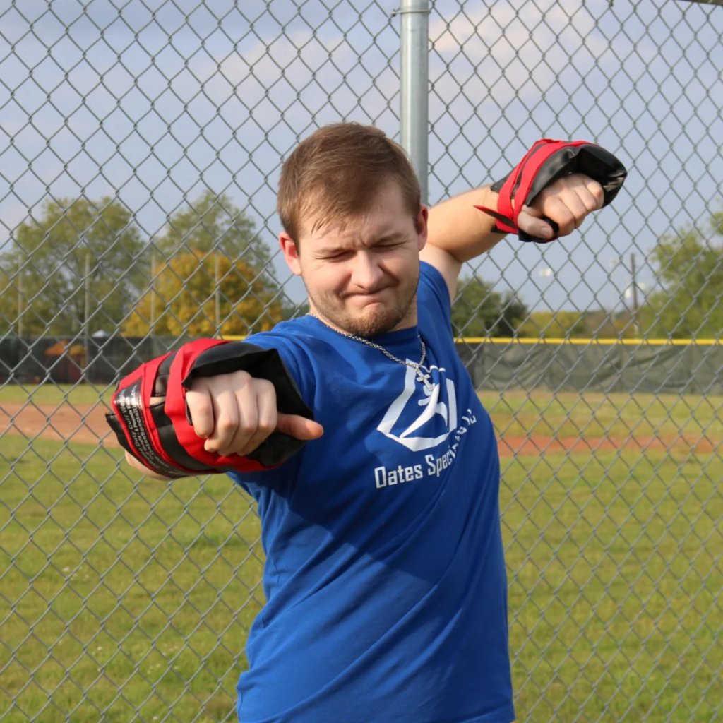 Athlete performing backstroke shoulder exercise wearing Weighted Cuffs for strength training.