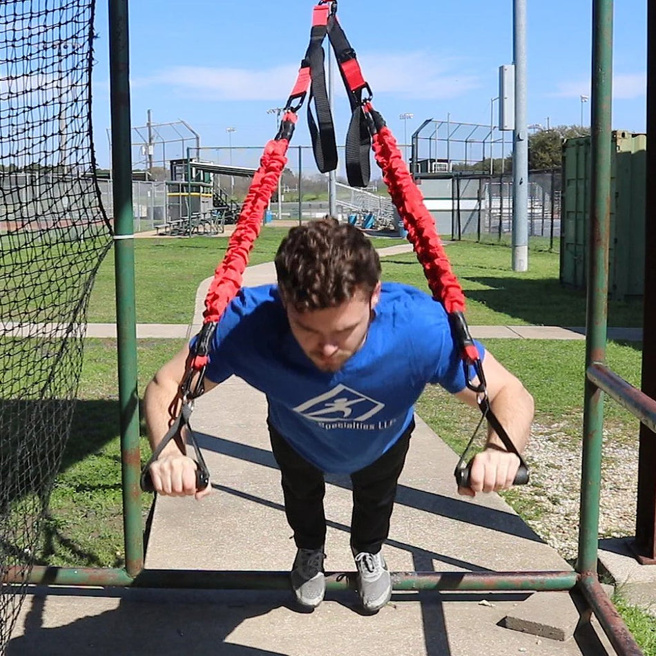 Athlete executing suspended push-ups with the KHAOS® Bungee Suspension Trainer, engaging core stability and upper-body strength while adapting to dynamic resistance from shifting bungees.